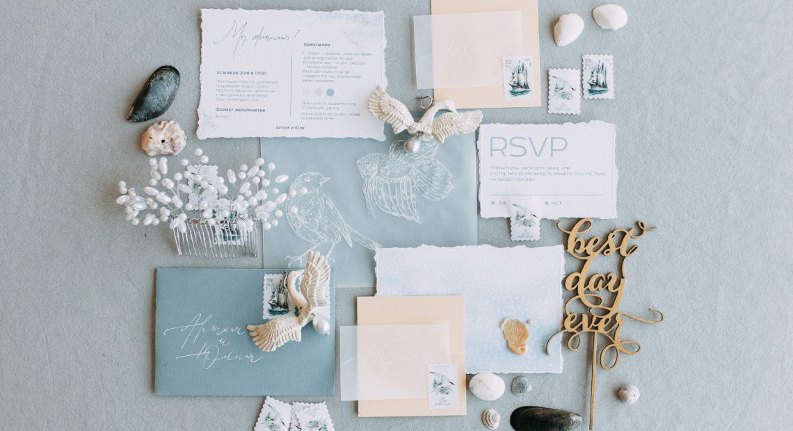 Stylish printing at the wedding ceremony, beautiful details and decor with flowers and rings. Wedding invitations